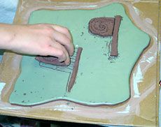 A ceramic tile created in USU ArtsBridge project