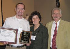 USU's Thomas Higbee receiving his award