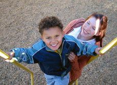 child and teacher at playground
