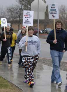 USU football players in Walk-a-Mile event