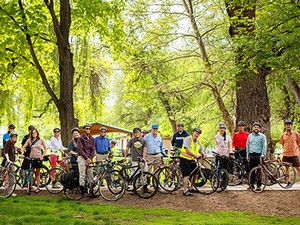cyclists posing with bikes on USU campus