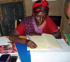 Somali-Gura woman working on recordkeeping