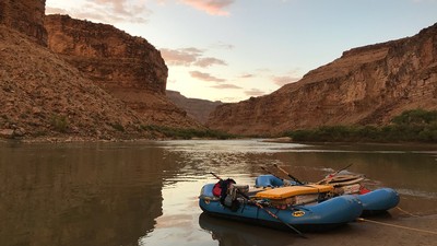 River raft with mountains in the background.