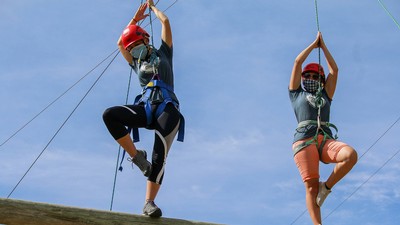 Aggies on a rope course.