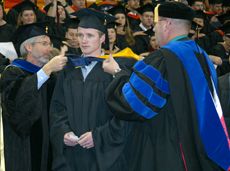 graduate student being hooded