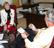 Noelle Call presents book to President Albrecht