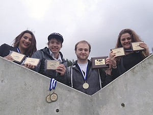USU debate team members with awards