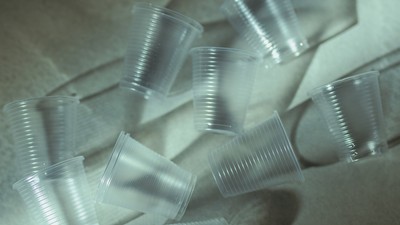 Plastic cups on a counter.