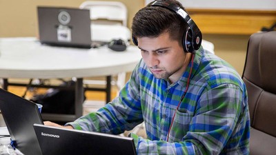 student studying at a computer.