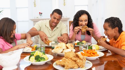 family eating at a dinner table.