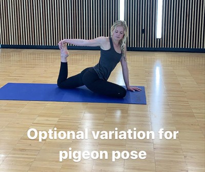 woman doing a variation of a pigeon yoga pose.