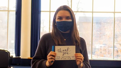 USU student holding a sign saying