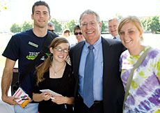 USU President Stan Albrecht with students at Hello Walk