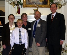 Eddy Berry and her family with President Hall 