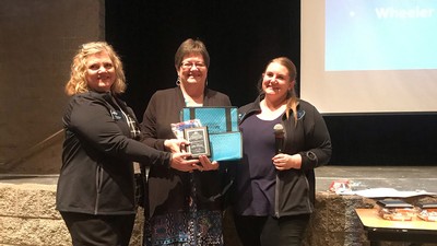 Julie Wheeler receiving her Lifetime Achievement Awards from two Utah teachers’ associations.