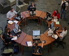 students at computers in the library