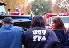 students watch demolition