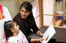 Lillian Duran reads to a child 