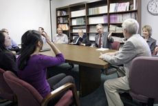 faculty in Department of Management and Human Resources conference room