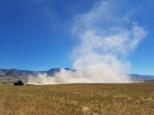 dust trail of one tractor