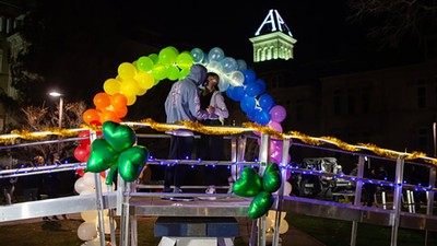 Students kiss on the block A on True Aggie Night.