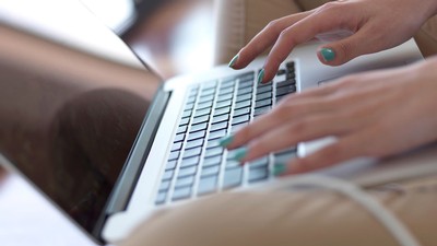 hands typing on a keyboard,