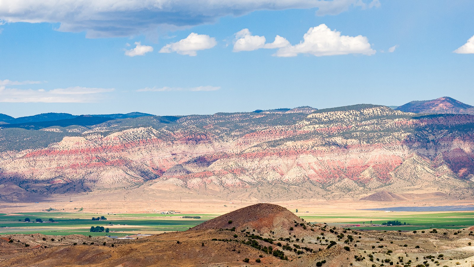 Photo of landscape in southwestern Utah, depicting red rock and hills
