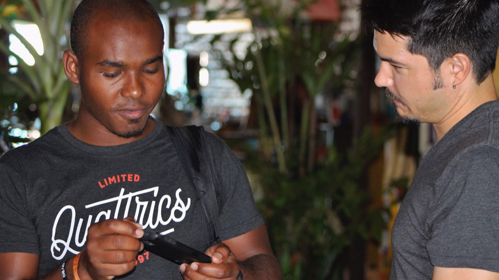 Researchers discuss a cell phone app in Brazil.