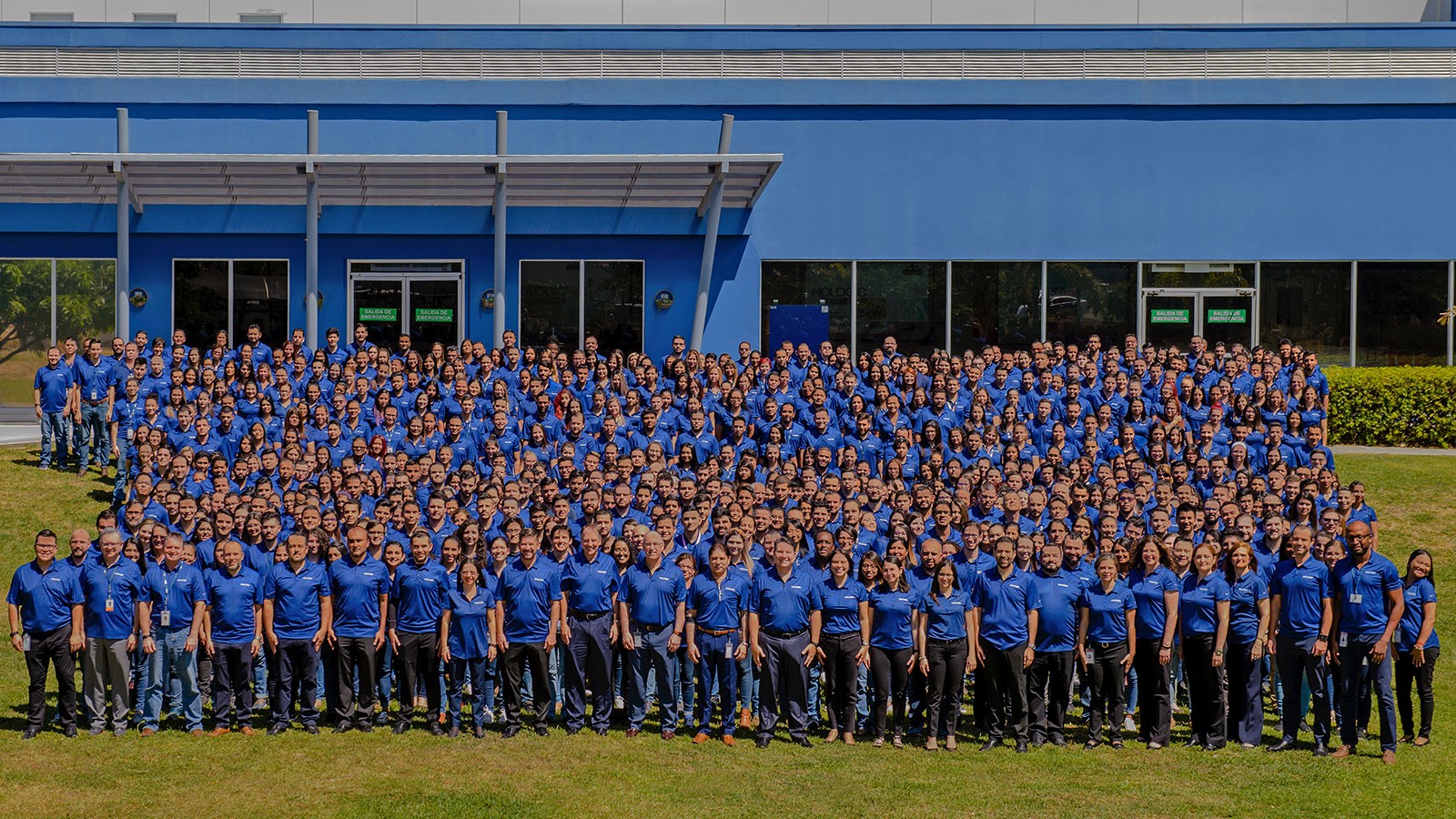 Hundreds of employees pose for a photograph in Costa Rica.