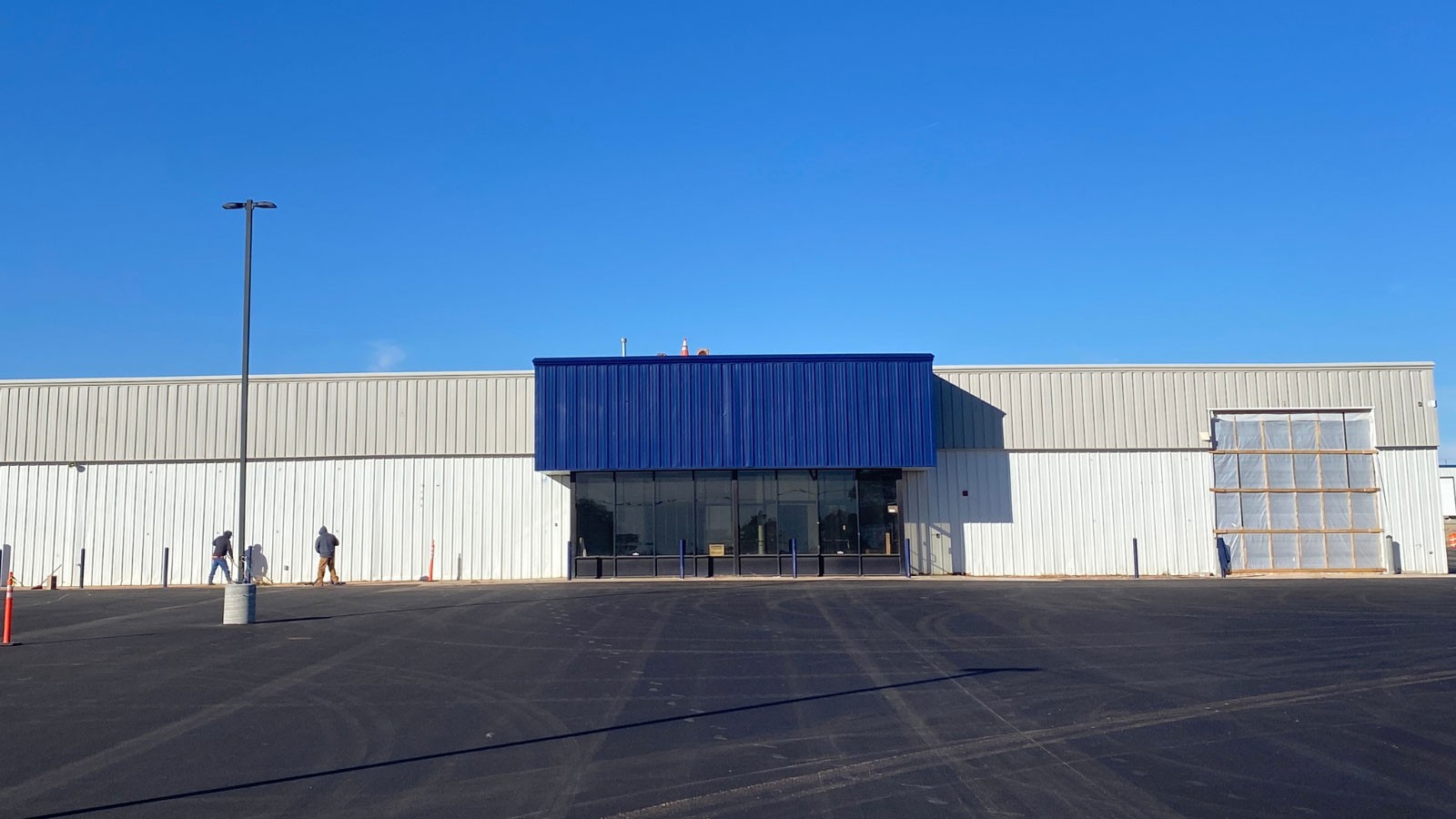 A former department store building repainted in Aggie blue, white and gray.