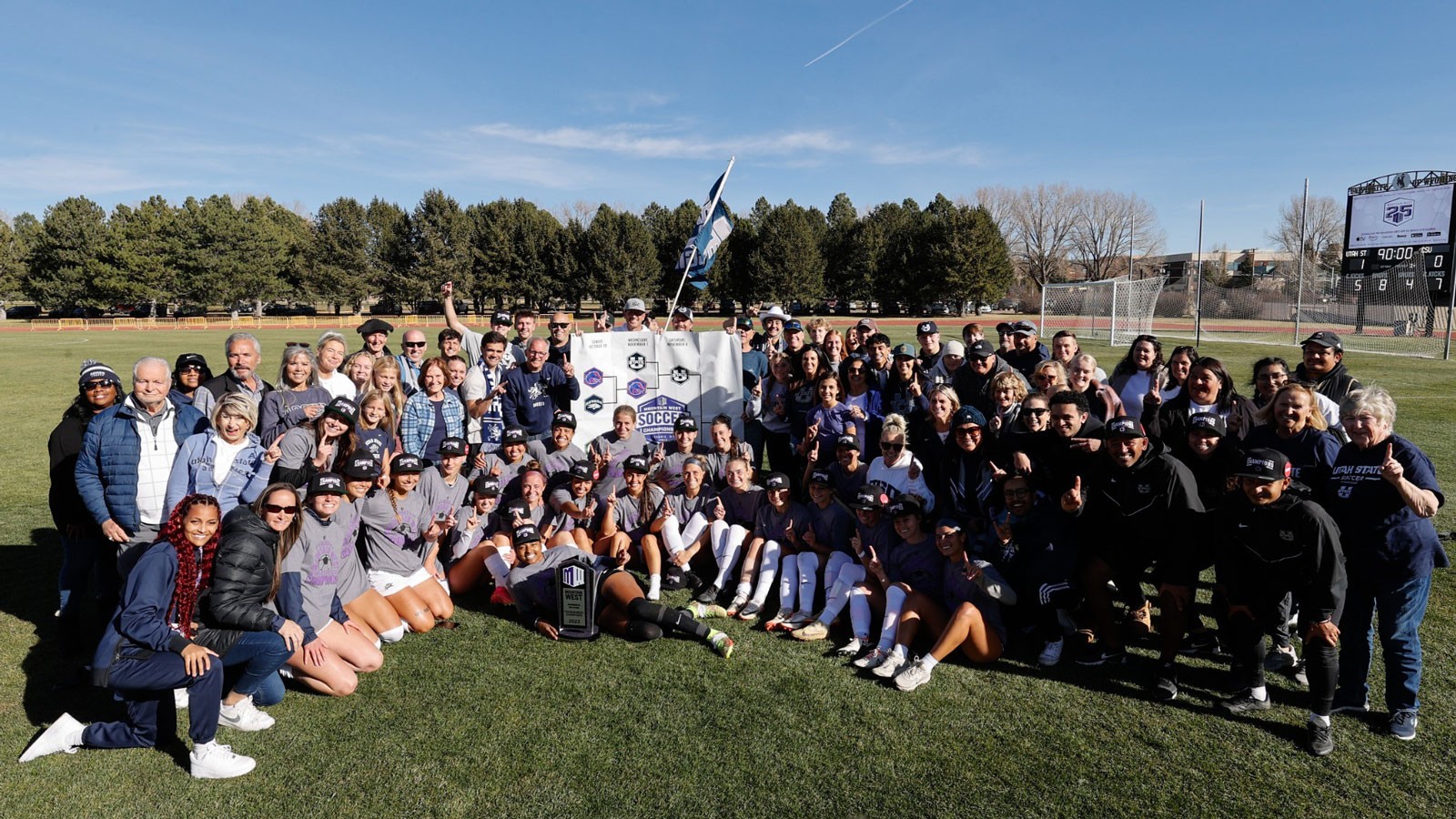 The USU Women's Soccer team posing for a photo.