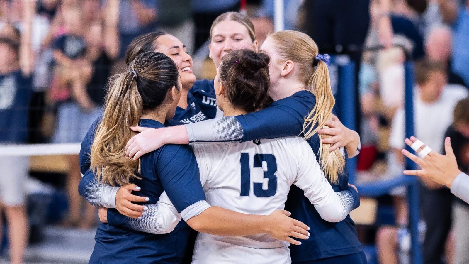 Volleyball players celebrating.