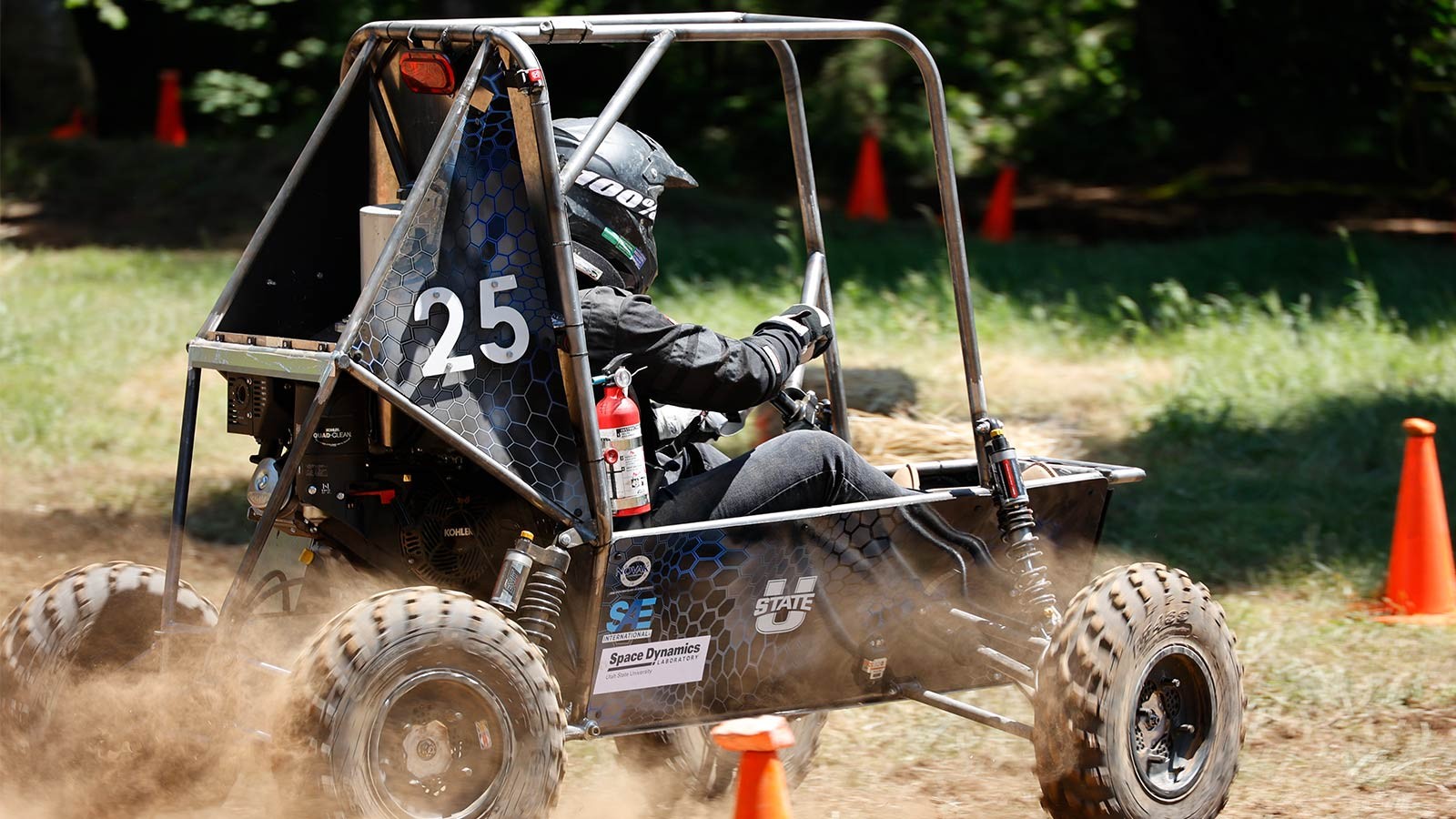 A person driving an off-road vehicle.