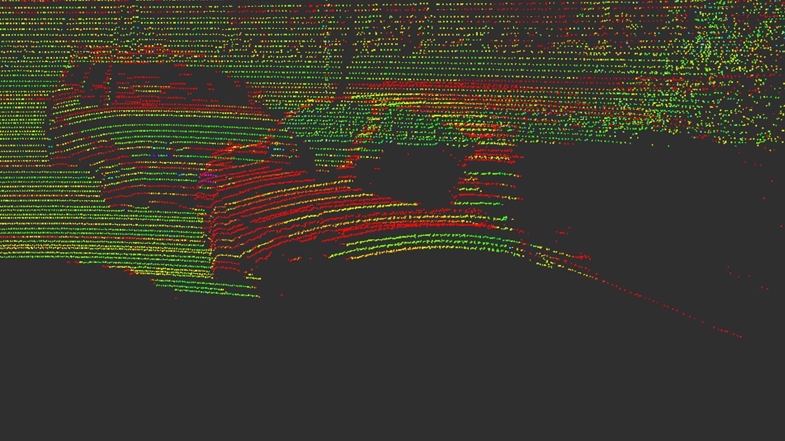Red, yellow and green dots on a black background show the contours of cars.