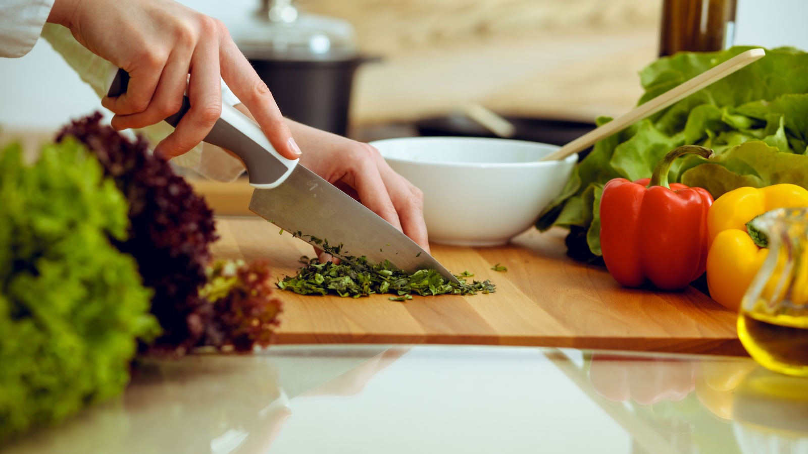 A person chopping vegetables.