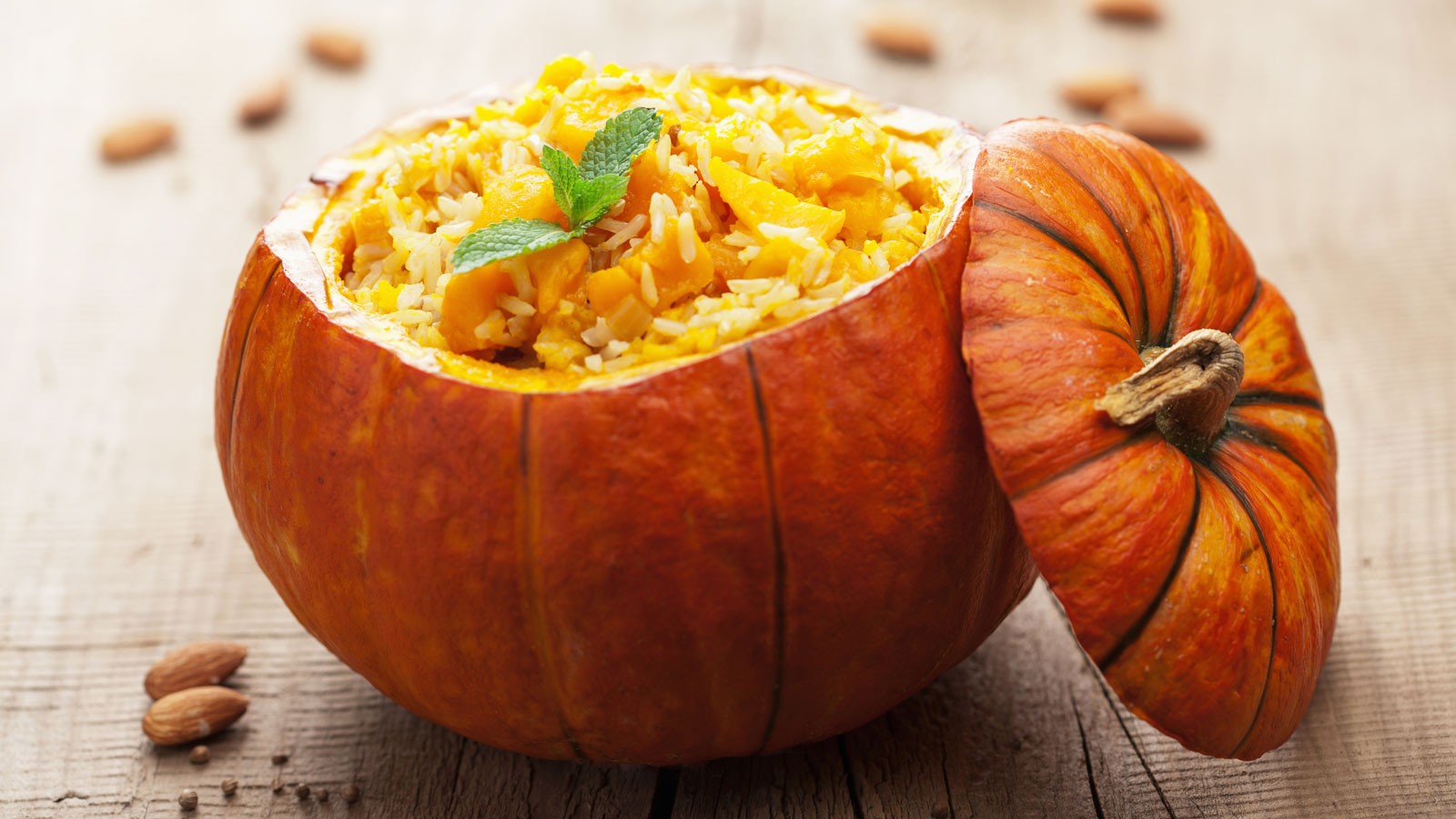 Pumpkin risotto inside a hollowed pumpkin bowl.