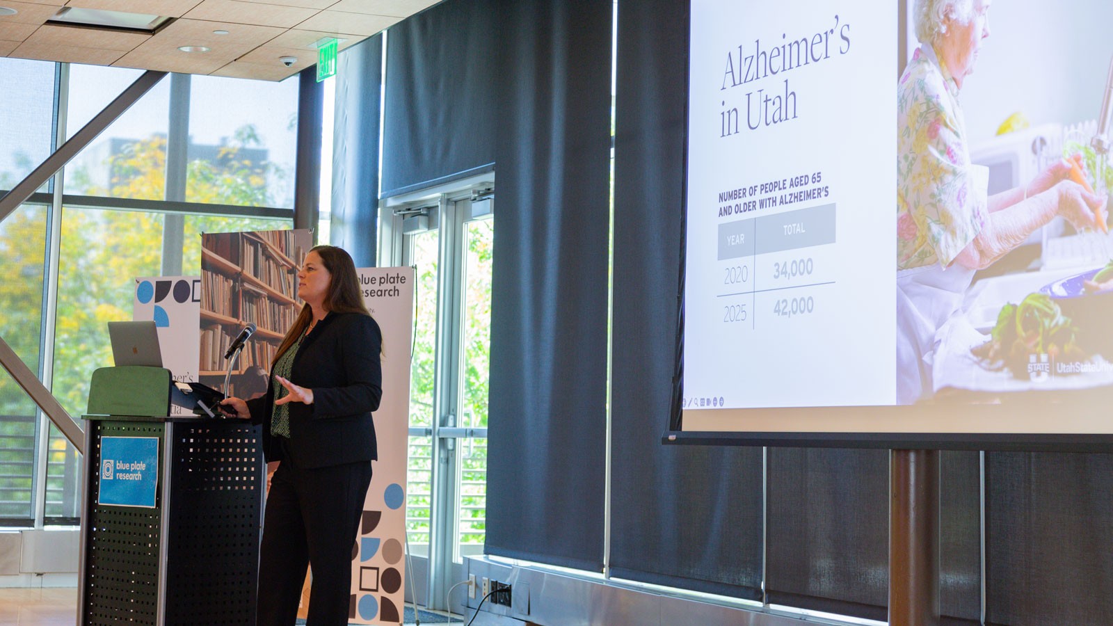 Beth Fauth speaking during a presentation.
