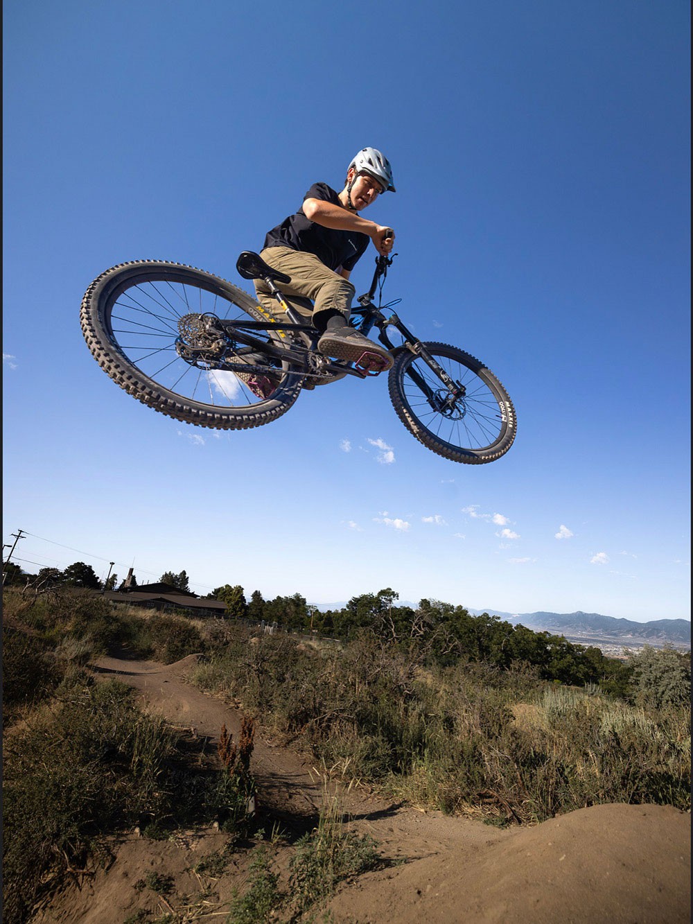 A mountain biker in midair.