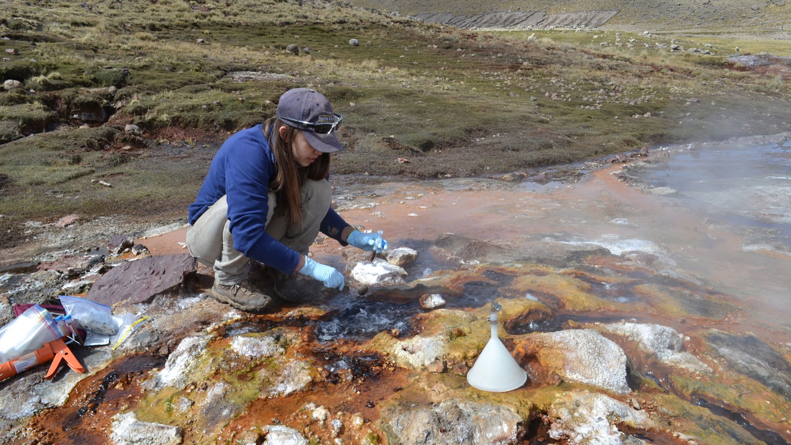 A geoscientist working in a hot spring.