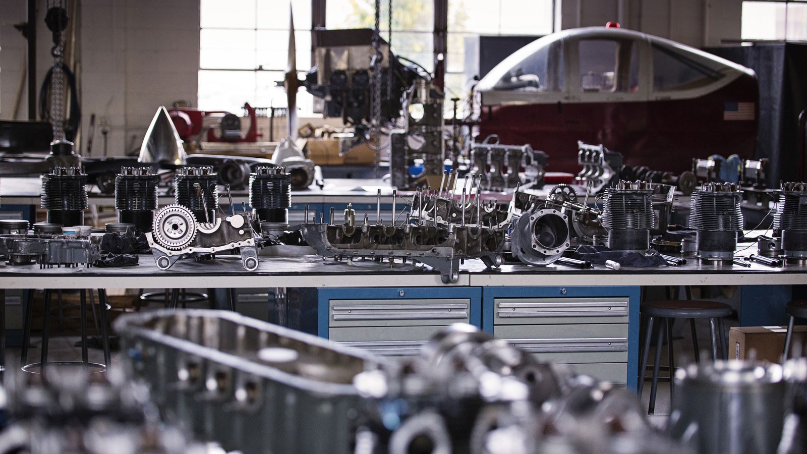 Airplane engine parts on a workbench.