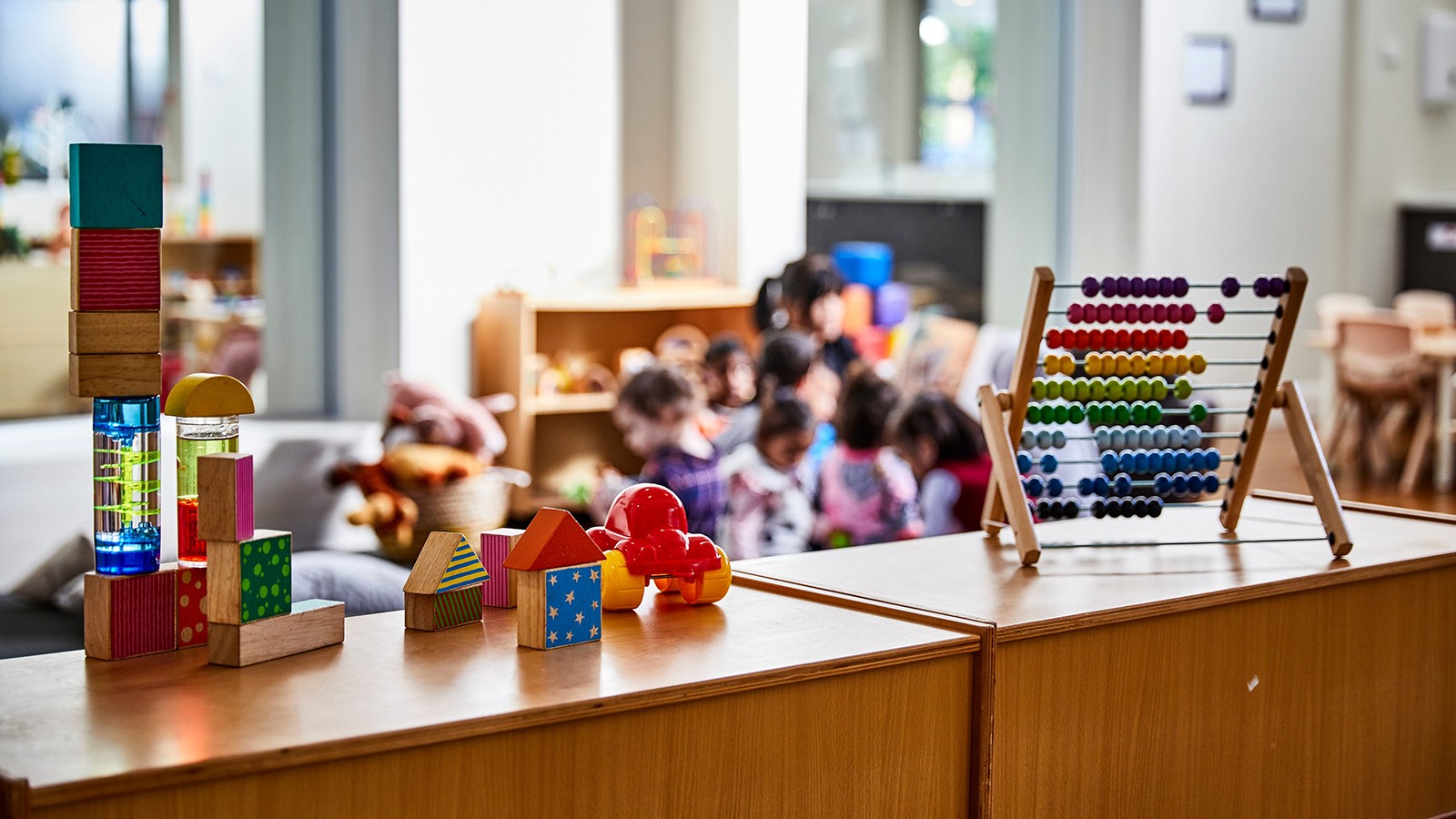 Photo of children's toys on top of a shelf