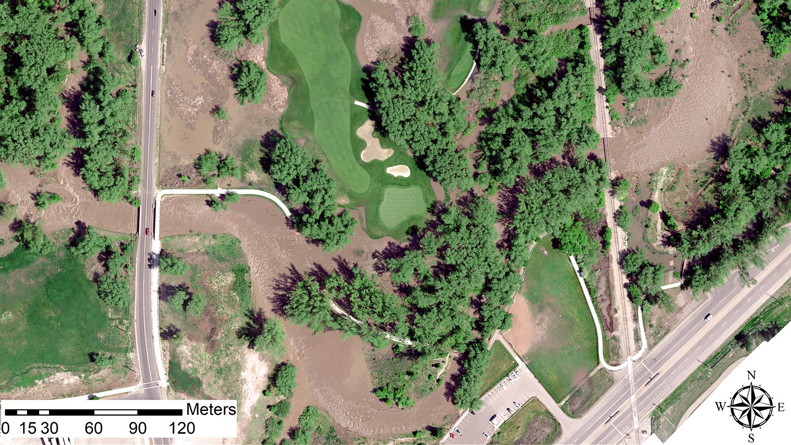 An aerial photograph of flooding on the Logan River Golf Course.