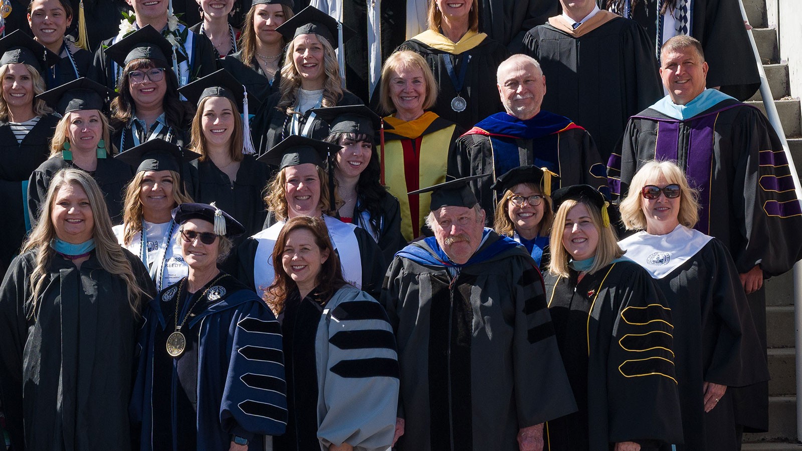 People in academic robes.