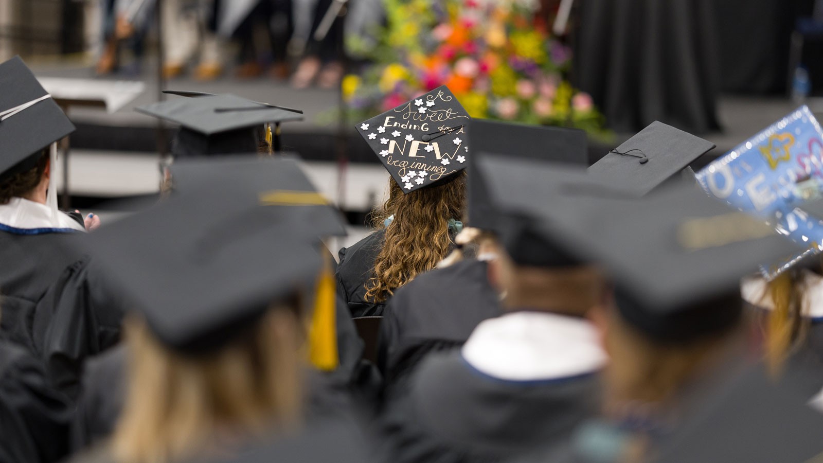 Students in graduation caps and gowns.