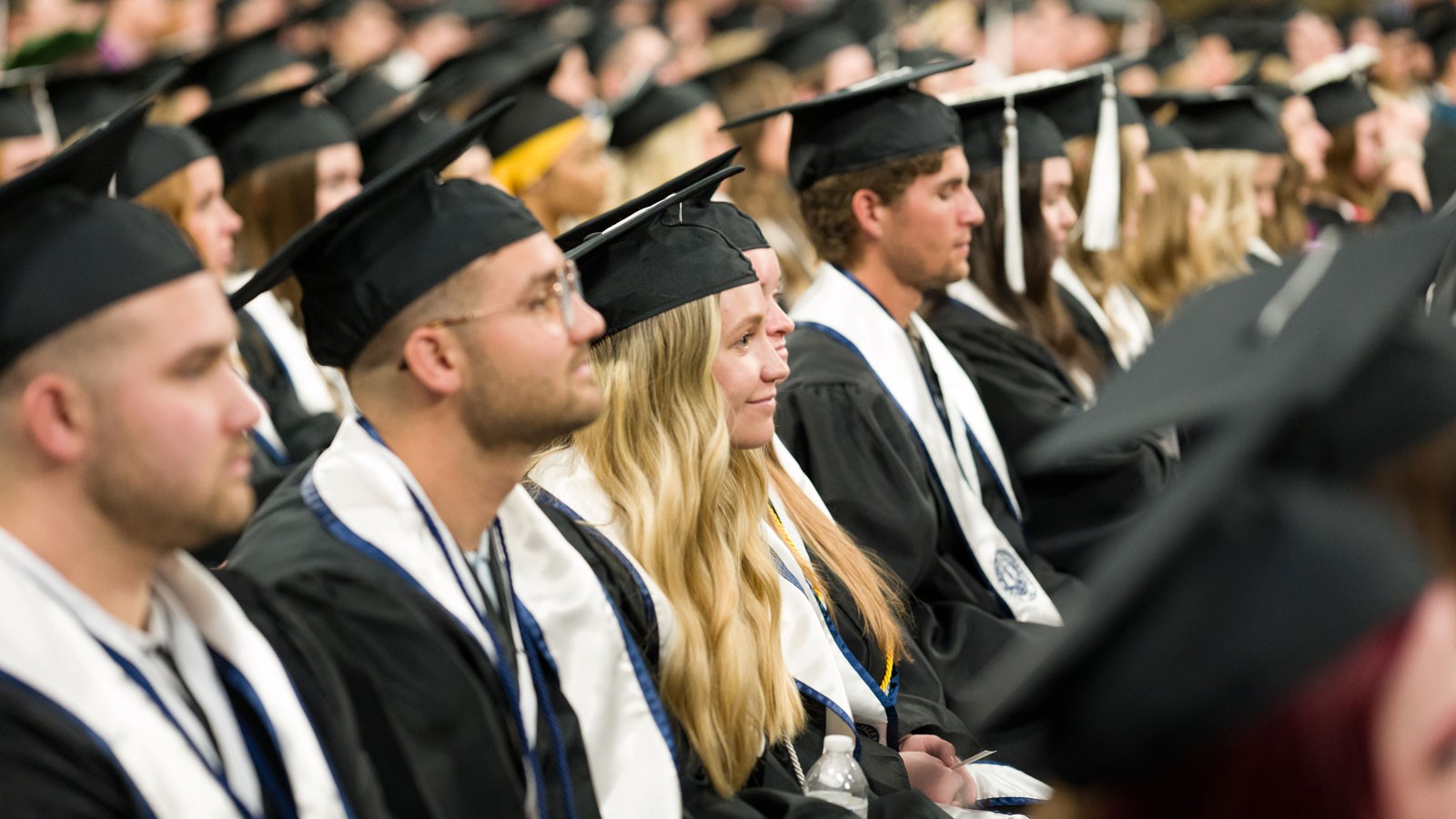 People in graduation robes.