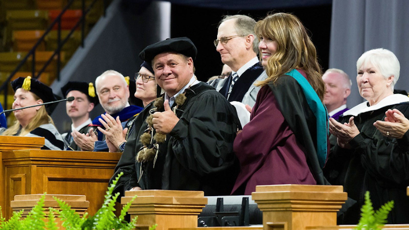 Honorary degree recipients at the rostrum at commencement in 2024.