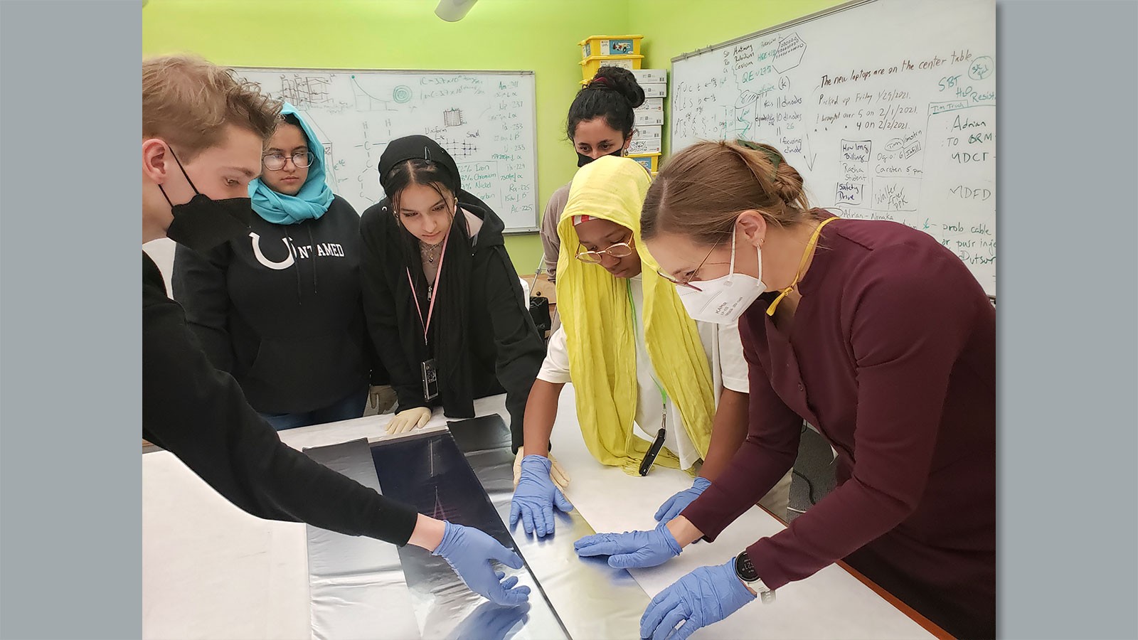 People working on a STEM project.