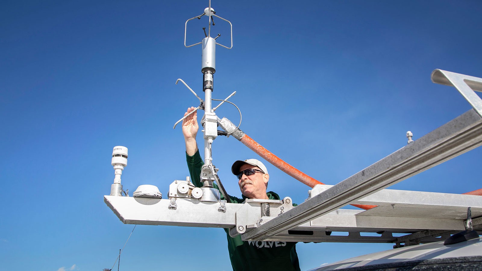 Randy Martin adjusting air quality instruments.