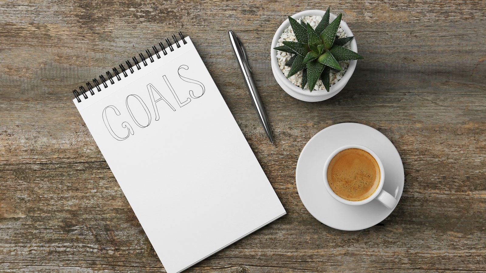 A notepad that says "goals."