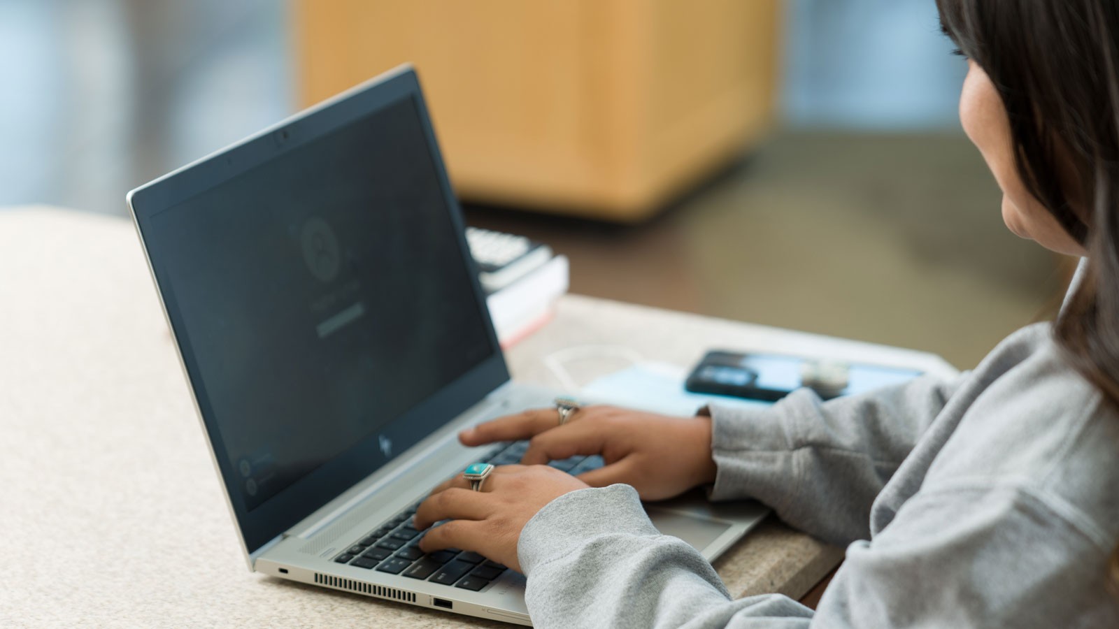 A person using a laptop.